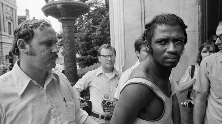 Herman Bell, seen on Sept. 1, 1973, after his arrest in New Orleans, was convicted of fatally shooting two NYPD officers in 1971. Photo Credit: AP