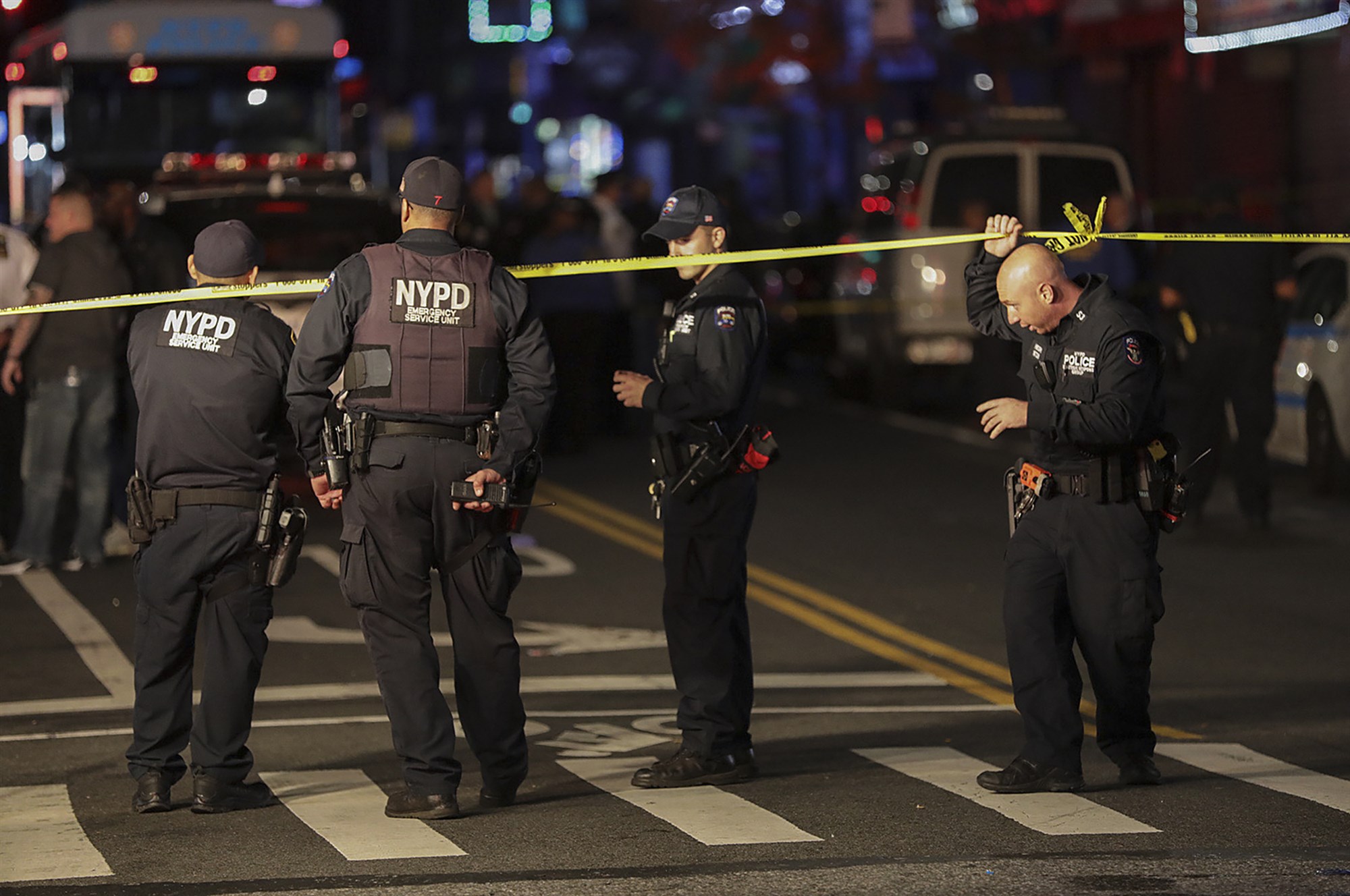 New York Police investigate the scene of a shooting where two police office...
